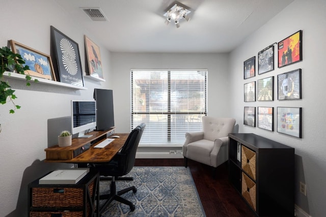 office space featuring dark wood-style floors and visible vents