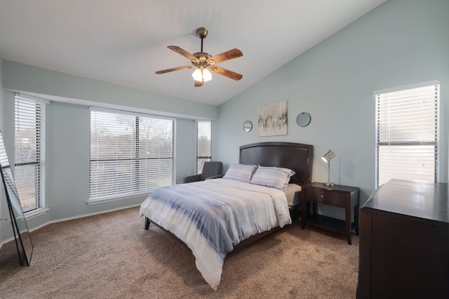 bedroom with carpet floors, vaulted ceiling, baseboards, and ceiling fan