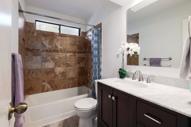 full bathroom featuring toilet, wood finished floors, vanity, and shower / tub combo with curtain