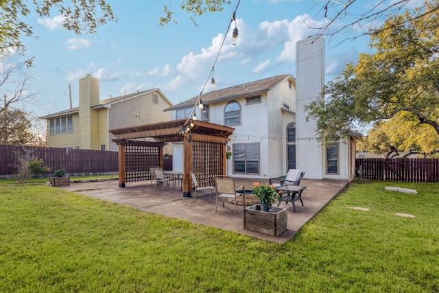 rear view of house with a fenced backyard, a lawn, a pergola, a chimney, and a patio area