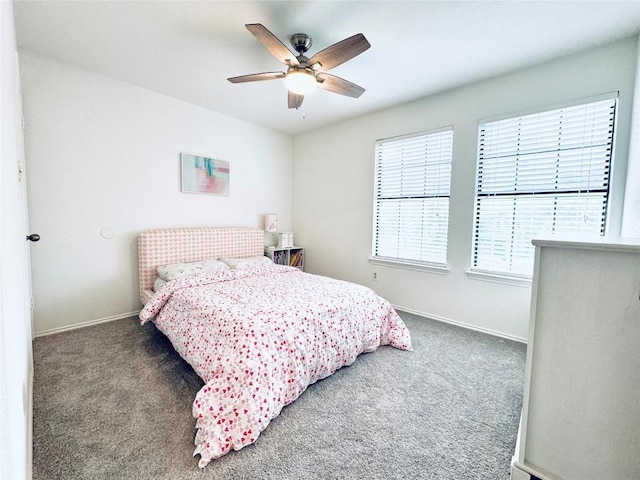 bedroom featuring carpet, baseboards, and a ceiling fan