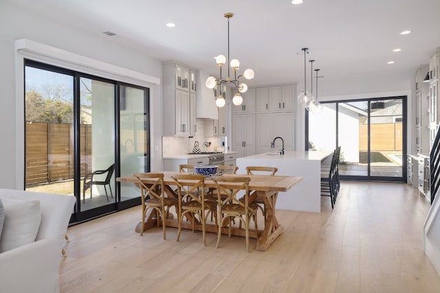 dining room with recessed lighting, visible vents, and light wood-style floors