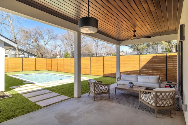 view of patio / terrace featuring a ceiling fan, a fenced in pool, a fenced backyard, and outdoor lounge area