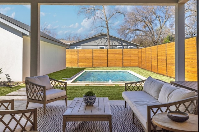 view of pool with a patio area, a fenced backyard, an outdoor living space, and a fenced in pool