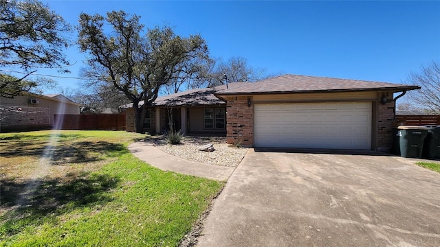 view of front of house with concrete driveway, an attached garage, fence, a front lawn, and brick siding