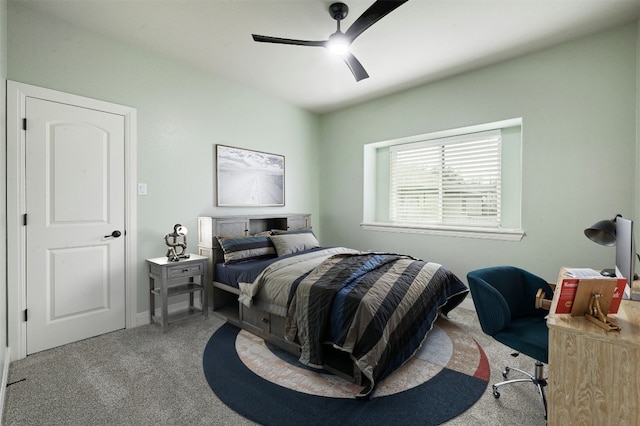 bedroom with a ceiling fan and carpet flooring