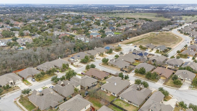 birds eye view of property with a residential view