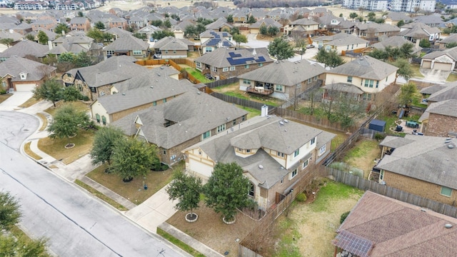 birds eye view of property with a residential view