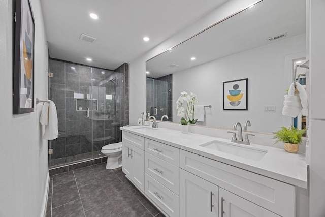 full bath with toilet, a sink, and visible vents