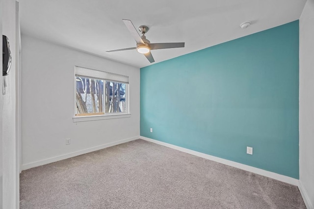 unfurnished bedroom featuring carpet flooring, ceiling fan, and baseboards