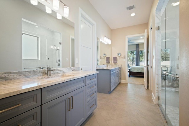 full bathroom featuring visible vents, ensuite bathroom, vanity, a shower stall, and recessed lighting