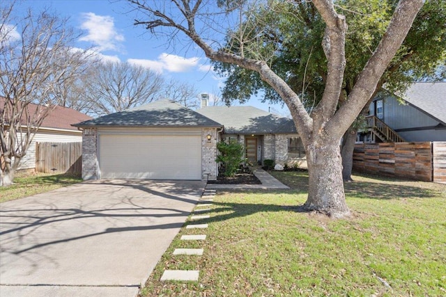 view of front of property featuring a garage, brick siding, concrete driveway, fence, and a front yard