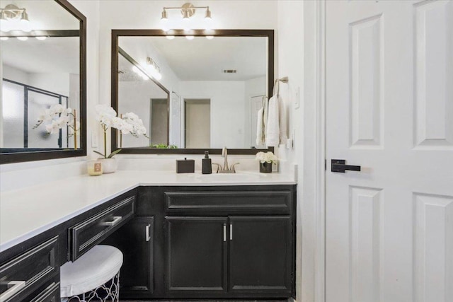 bathroom featuring visible vents and vanity