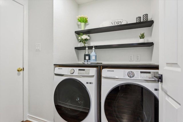 washroom with laundry area and washer and clothes dryer