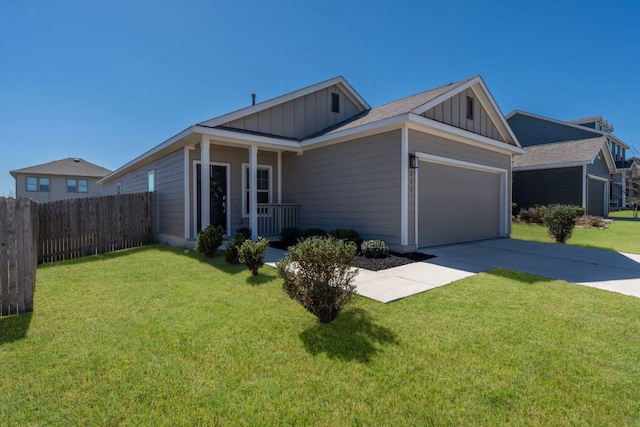 view of property exterior with a garage, fence, driveway, a lawn, and board and batten siding