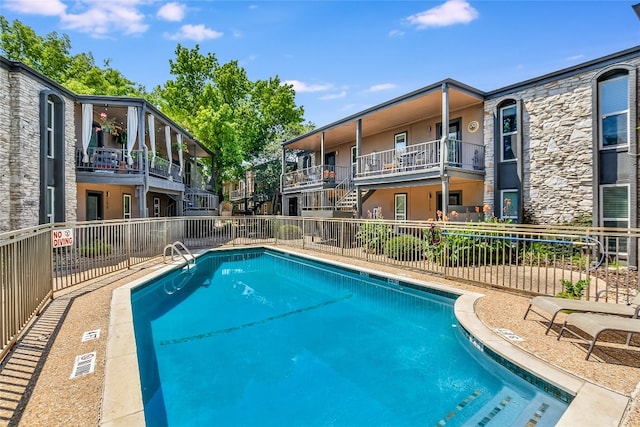 community pool with fence