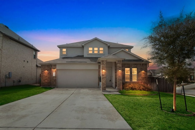 6500 Cetone Ter, Round Rock, TX 78665 - view of front of property featuring driveway, stucco siding, brick siding, a garage, and a shingled roof