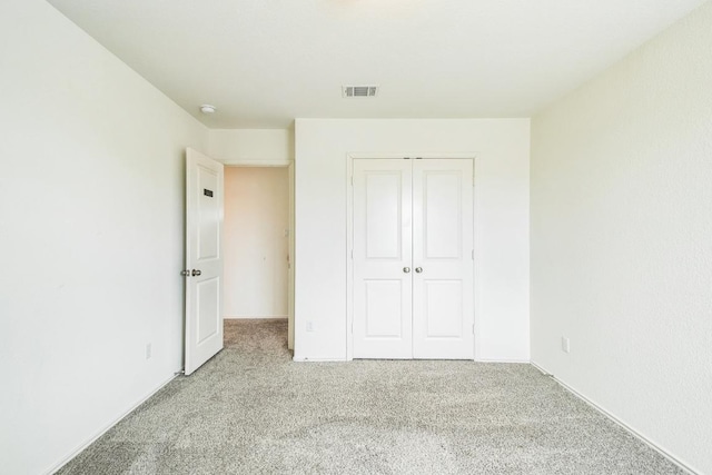 6500 Cetone Ter, Round Rock, TX 78665 - unfurnished bedroom featuring carpet flooring, a closet, and baseboards
