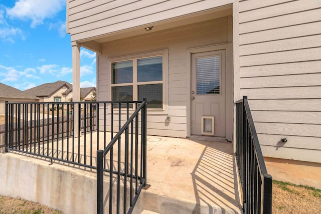 entrance to property with a balcony