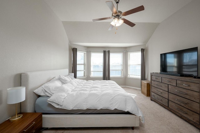 bedroom with a ceiling fan, lofted ceiling, light colored carpet, and baseboards