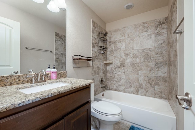 full bathroom featuring shower / washtub combination, vanity, and toilet