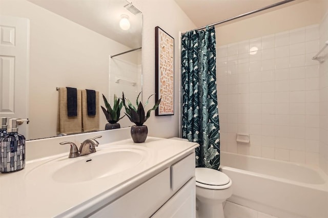 full bath featuring visible vents, shower / tub combo, vanity, and toilet