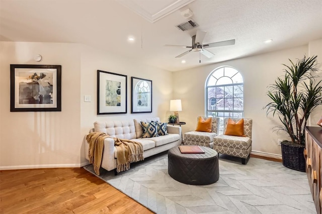 living room featuring light wood finished floors, recessed lighting, visible vents, ceiling fan, and baseboards