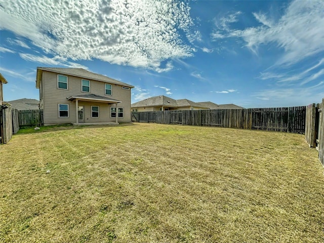 view of yard with a fenced backyard