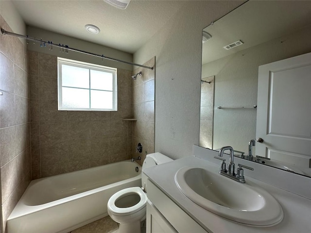 bathroom featuring toilet, shower / bathtub combination, vanity, and visible vents