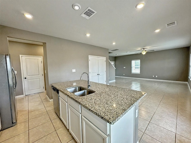 kitchen featuring light tile patterned floors, visible vents, appliances with stainless steel finishes, and a sink