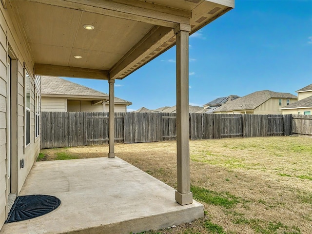 view of yard featuring a patio area and a fenced backyard