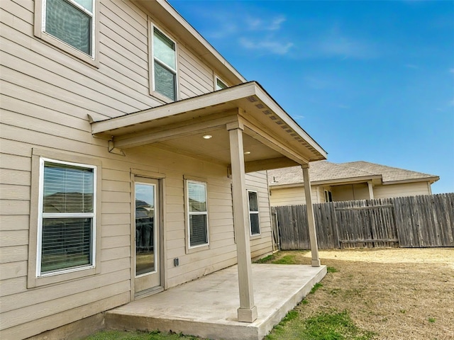 back of house featuring a patio and fence