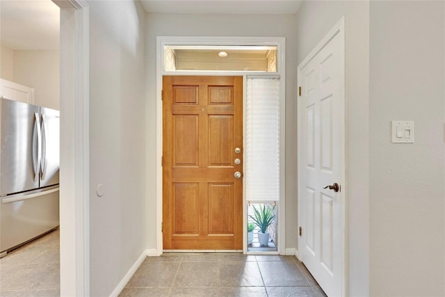 entryway featuring baseboards