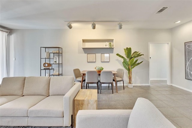 living room featuring baseboards, recessed lighting, visible vents, and tile patterned floors