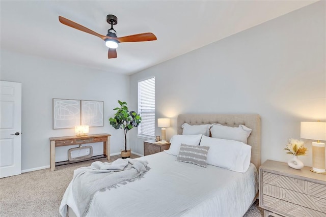 bedroom featuring carpet, baseboards, and a ceiling fan