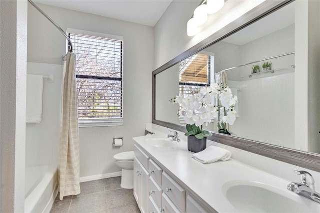 full bathroom with baseboards, a sink, toilet, and tile patterned floors