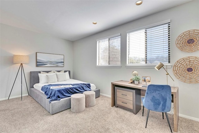 bedroom with light carpet, recessed lighting, and baseboards