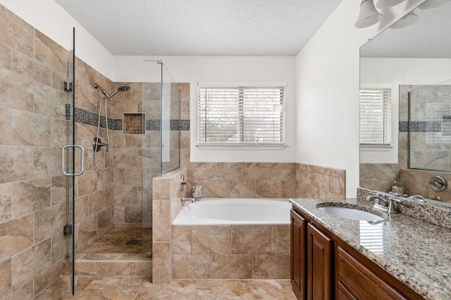 full bath featuring a stall shower, a healthy amount of sunlight, and a bath