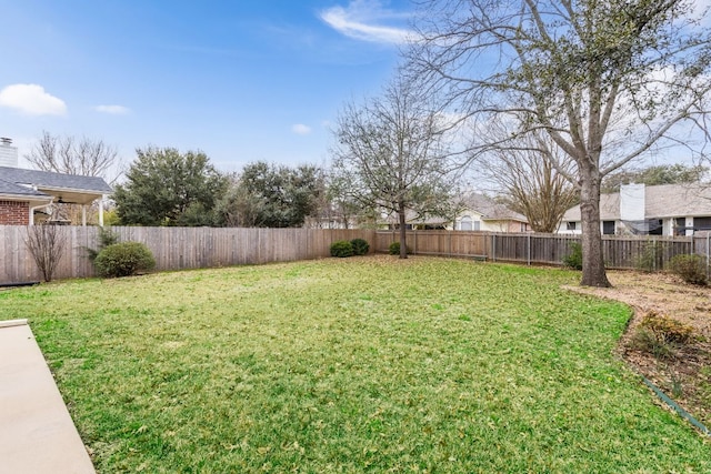 view of yard featuring a fenced backyard