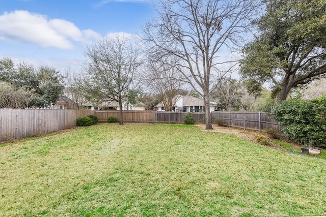 view of yard with a fenced backyard