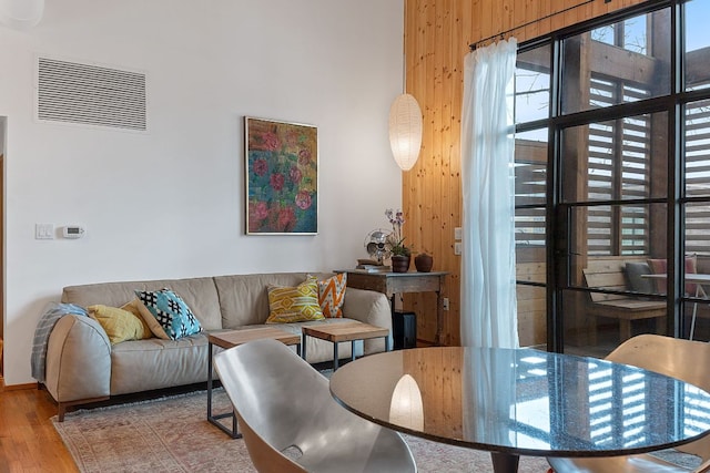 living room featuring wood finished floors and visible vents