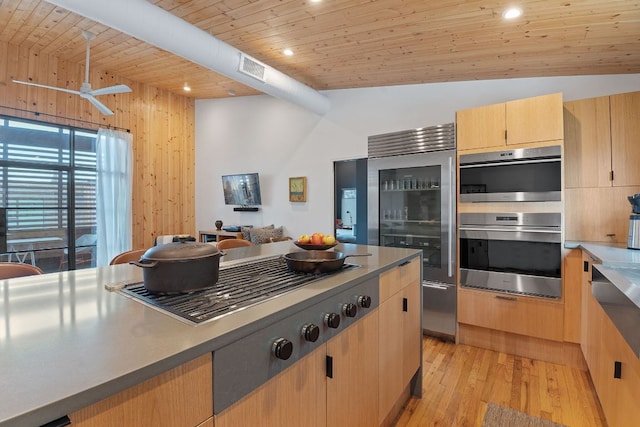 kitchen featuring wooden ceiling, recessed lighting, stainless steel appliances, light wood-type flooring, and light brown cabinetry