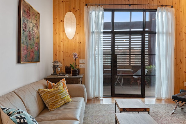 interior space with wooden walls and wood finished floors