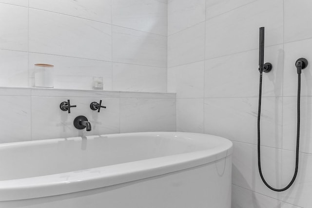 bathroom featuring a tub to relax in