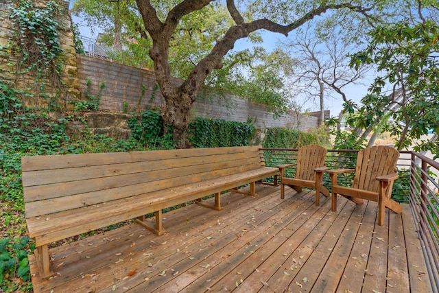 wooden deck featuring fence