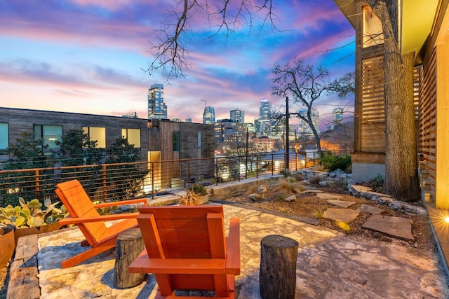 view of patio with a city view and a balcony