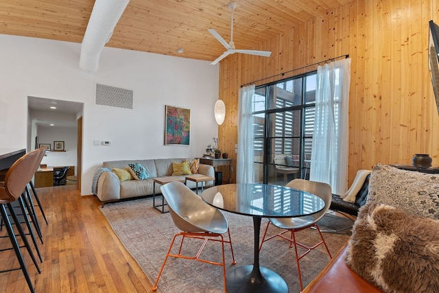 living room featuring visible vents, high vaulted ceiling, wooden ceiling, beamed ceiling, and hardwood / wood-style flooring