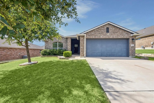 ranch-style home featuring a front lawn, brick siding, driveway, and a garage