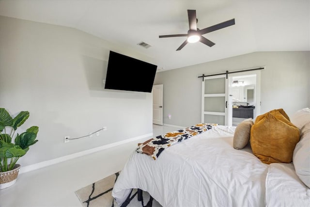 bedroom featuring a barn door, visible vents, connected bathroom, ceiling fan, and vaulted ceiling