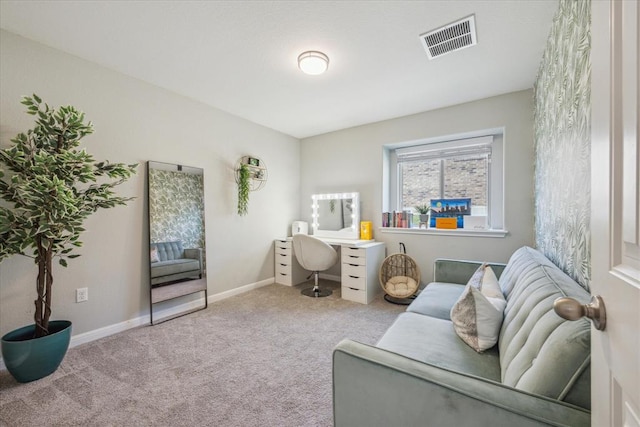 living area featuring visible vents, carpet flooring, and baseboards